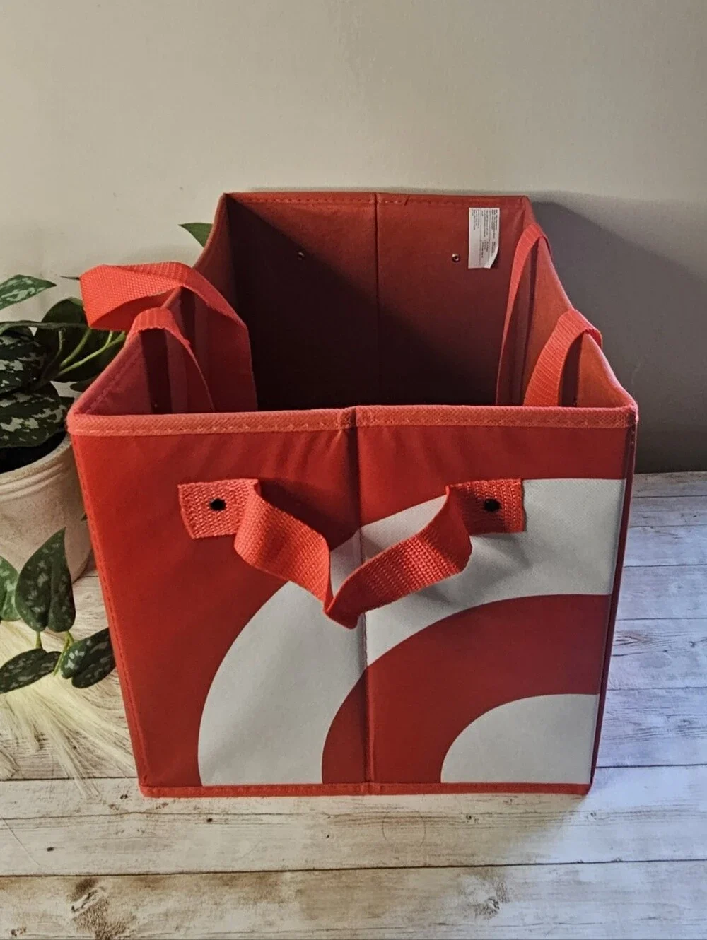 Target red collapsible box-style utility bag. It features a rectangular, boxy sh